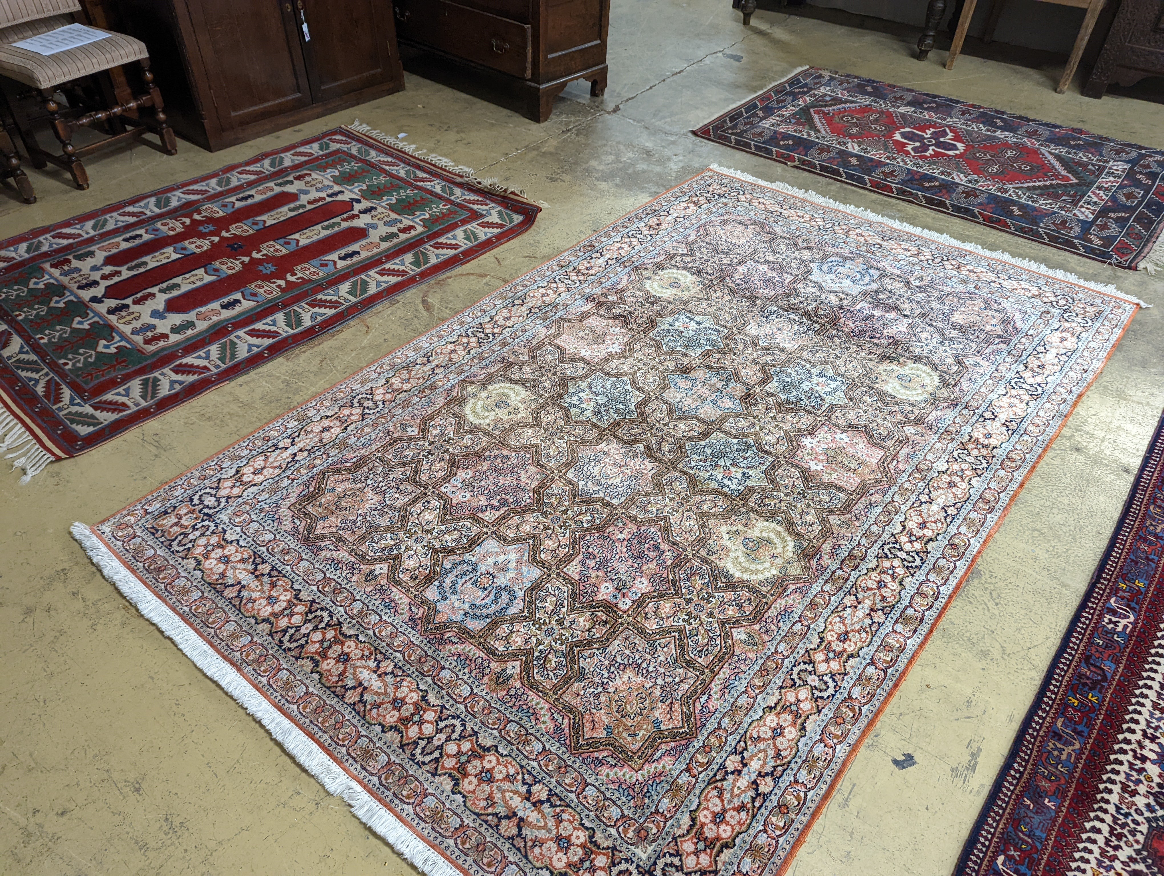 Two Turkish rugs and a Persian rugs. Largest, 284x172cm.
